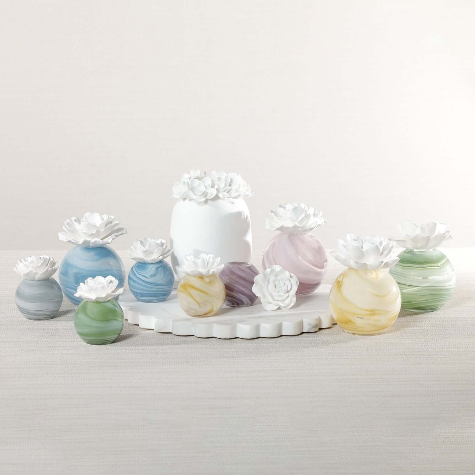 Petals Porcelain Diffuser - Large collection of marbled glass diffusers with delicate porcelain flowers.
