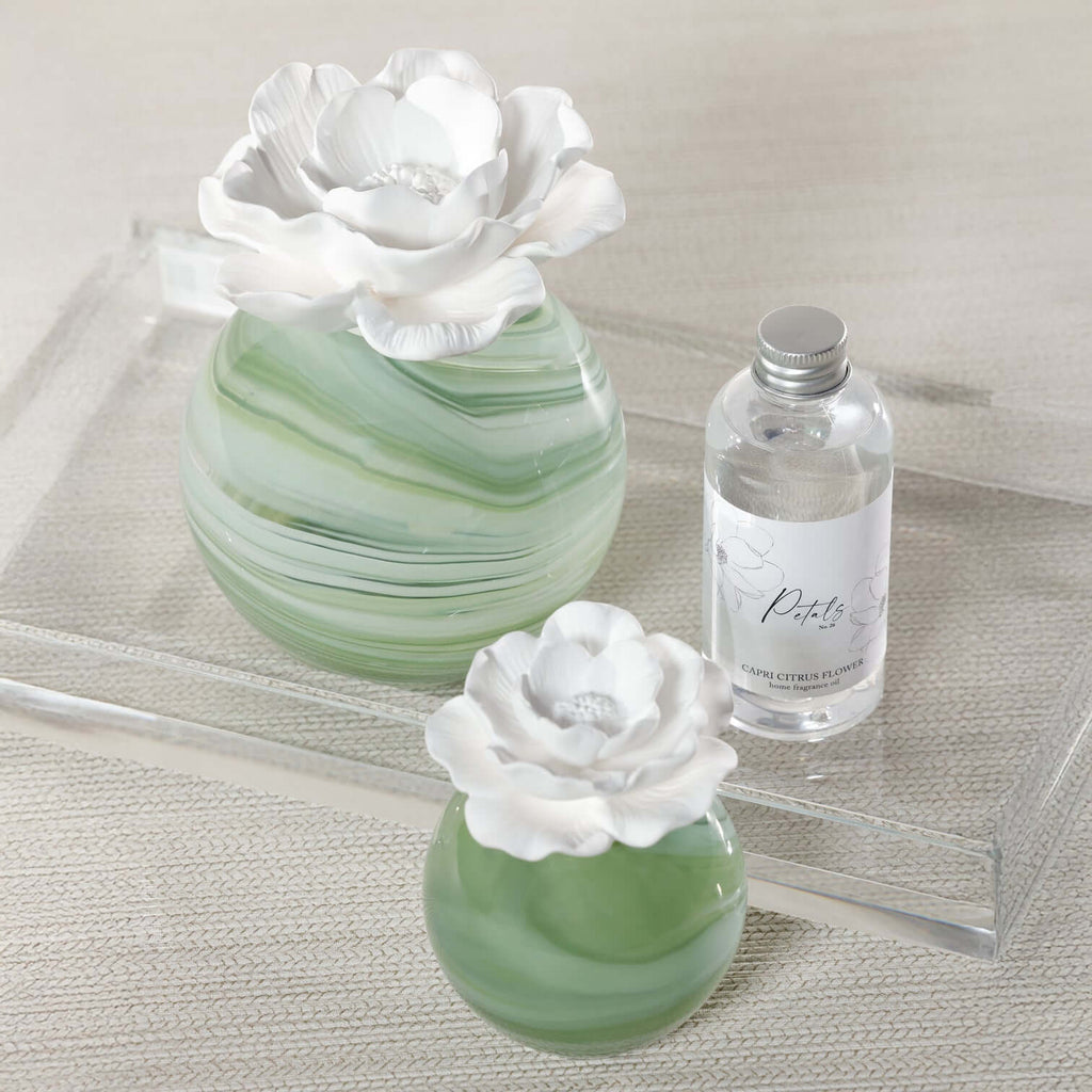 Petals Porcelain Diffuser - Large displayed with a marbled glass vessel and porcelain flower, enhancing home decor.
