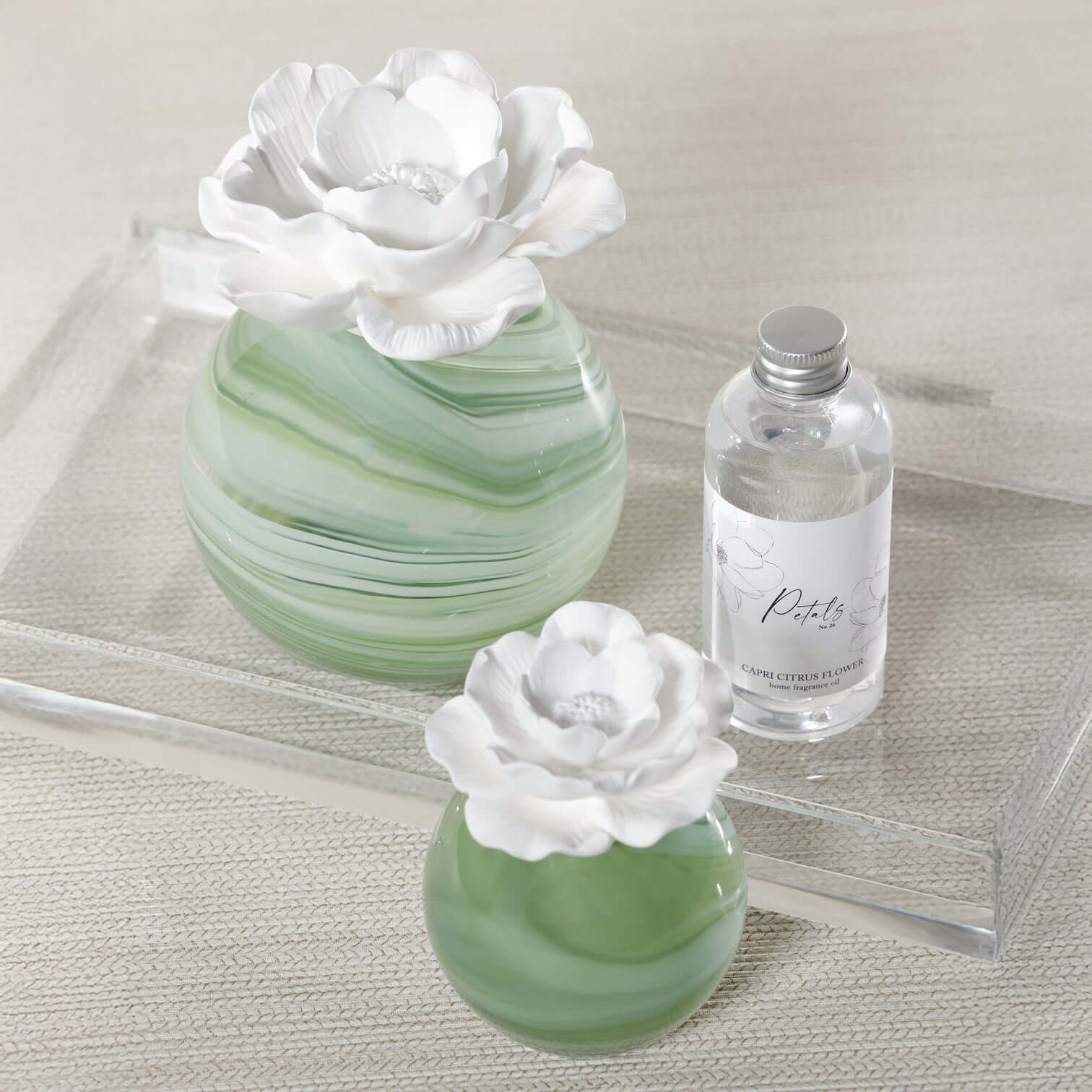 Petals Porcelain Diffuser - Large displayed with a marbled glass vessel and porcelain flower, enhancing home decor.