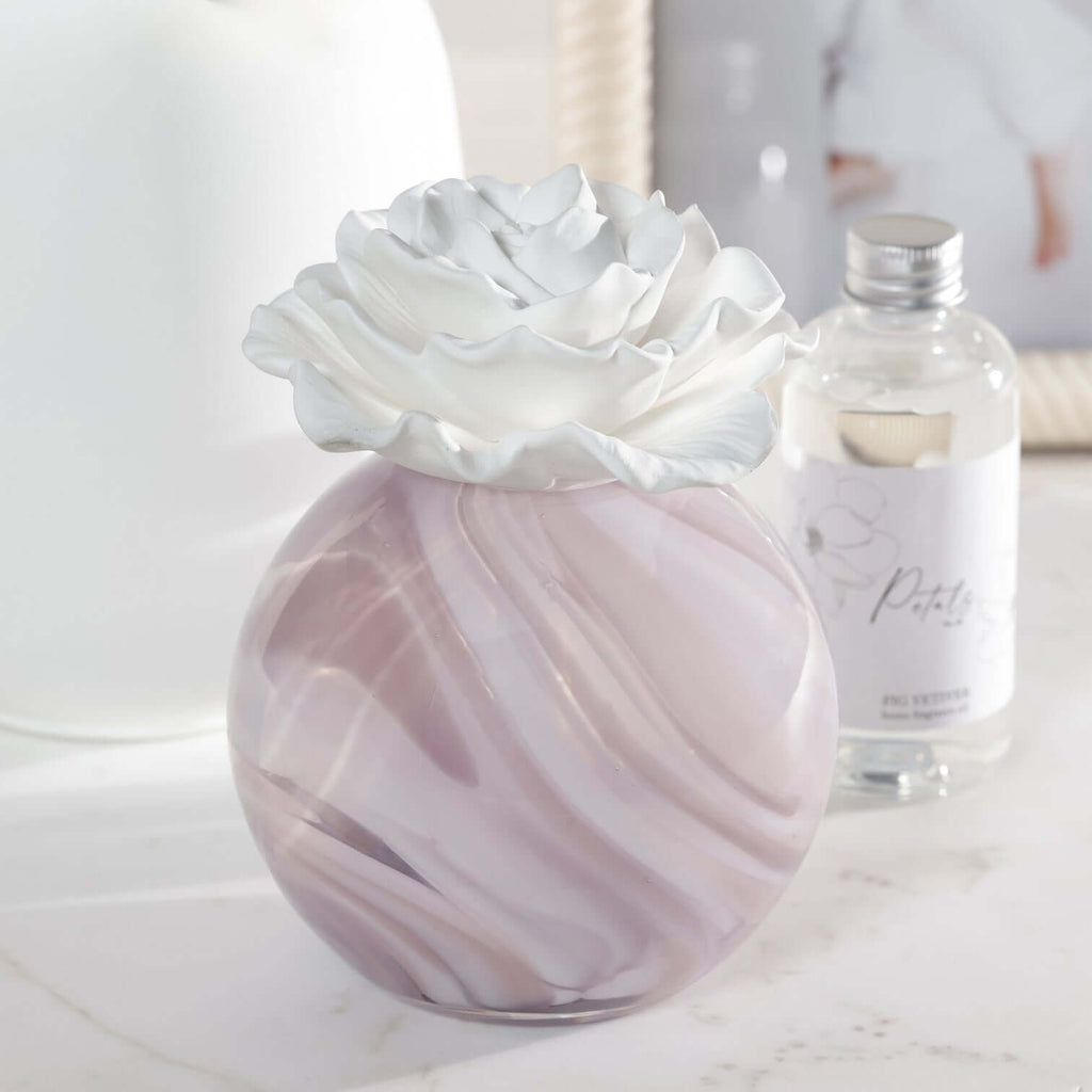 Petals Porcelain Diffuser - Large with a marbled glass vessel and porcelain flower, perfect for elegant home decor.