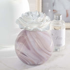 Petals Porcelain Diffuser - Large with a marbled glass vessel and porcelain flower, perfect for elegant home decor.