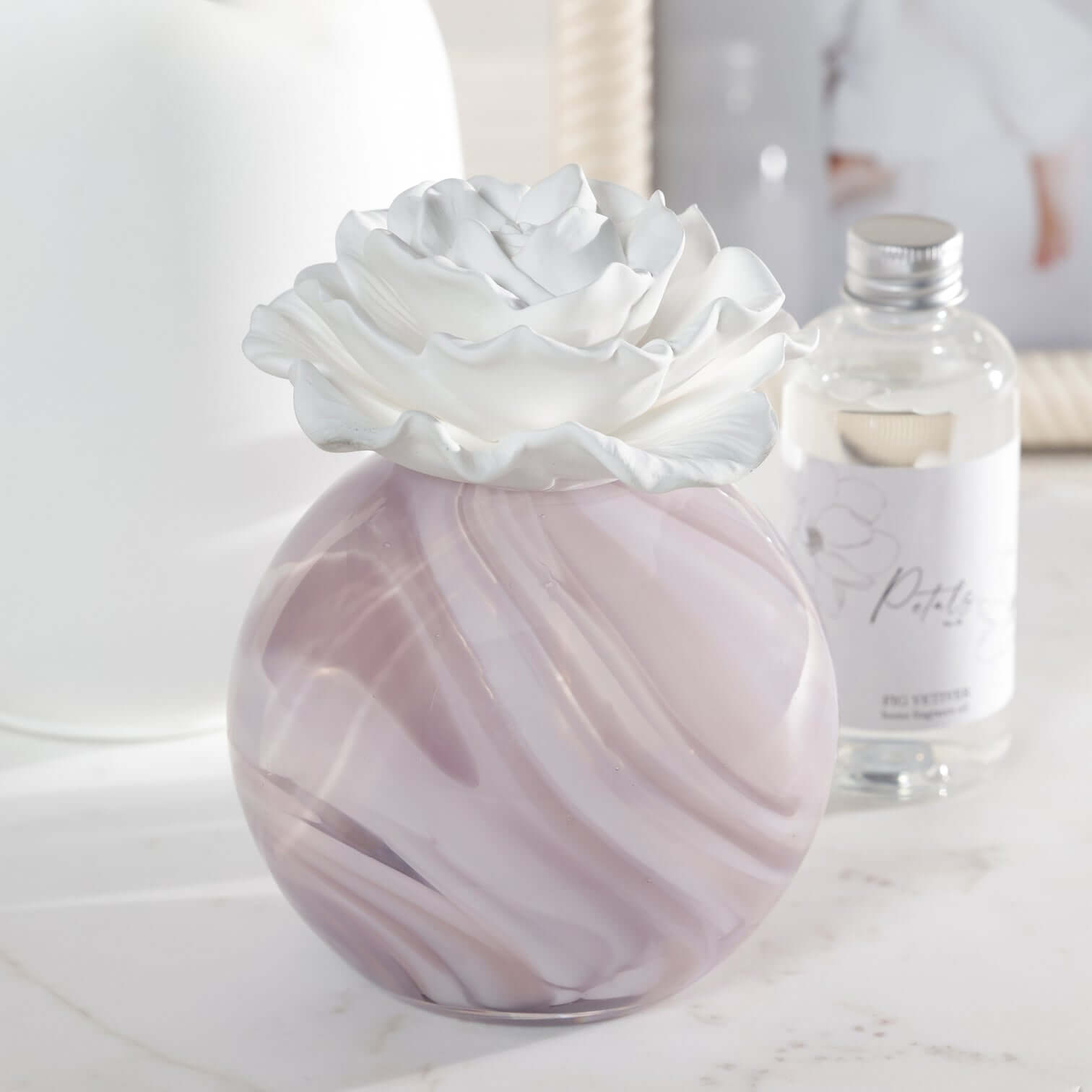 Petals Porcelain Diffuser - Large with a marbled glass vessel and porcelain flower, perfect for elegant home decor.