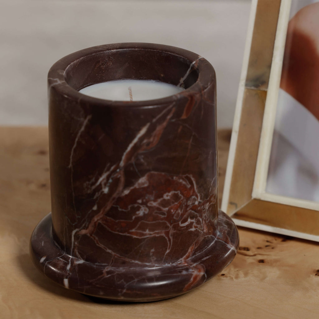 Marbella Scented Candle Jar with Cloche displayed on a wooden surface, showcasing natural marble design.