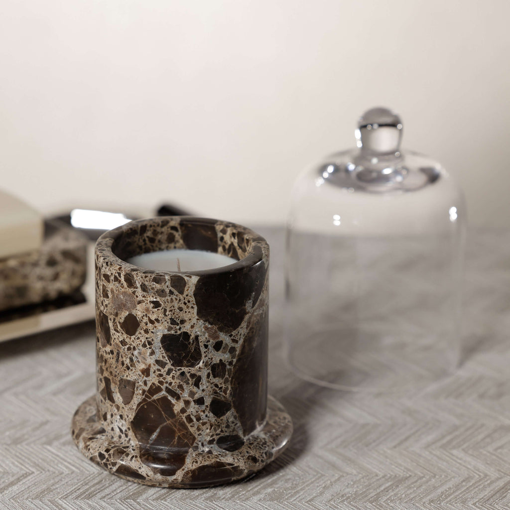 Marbella Scented Candle Jar with Cloche displayed on a textured surface, showcasing its unique marble design.