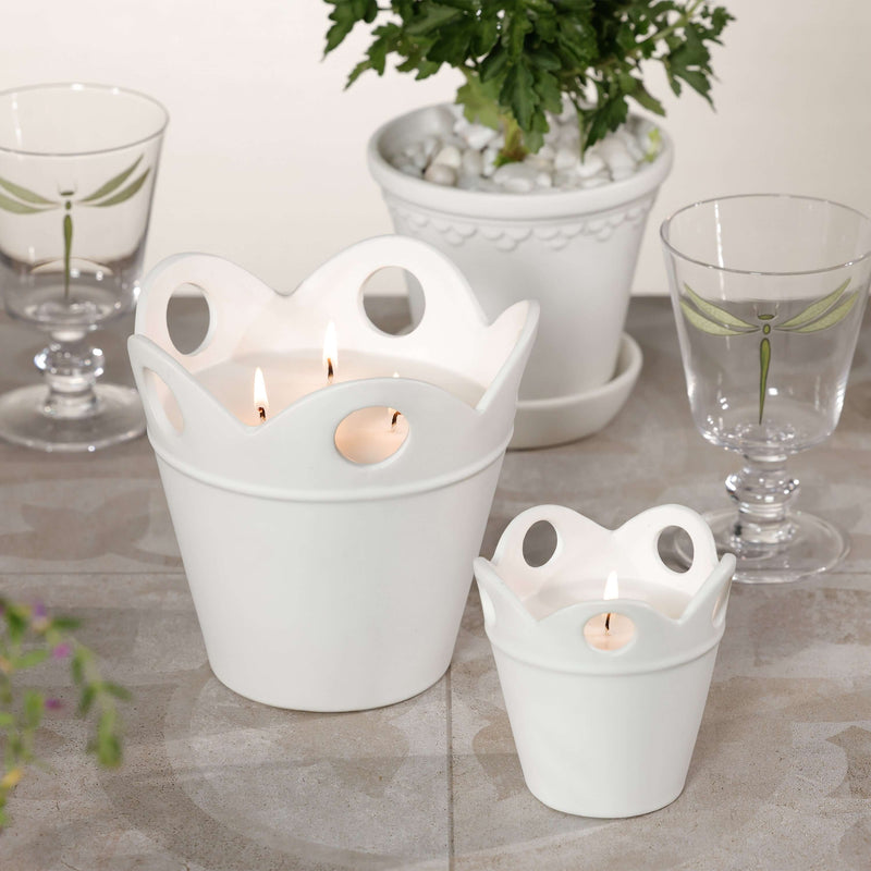 Citronella Pot Candle displayed in white ceramic pots, ideal for outdoor settings and adding elegance.