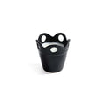Citronella Pot Candle in small black ceramic with scalloped rim and cut-out details.