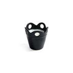 Citronella Pot Candle in small black ceramic with scalloped rim and cut-out details.
