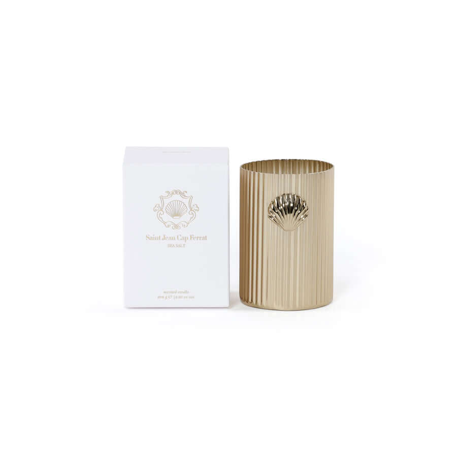 Cap Ferrat Fan Shell Design Candle in Gift Box featuring a fluted gold vessel and elegant shell emblem.