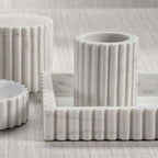 Camogli Bath Collection solid white marble pieces with sculpted vertical fluting for luxury bathroom decor.
