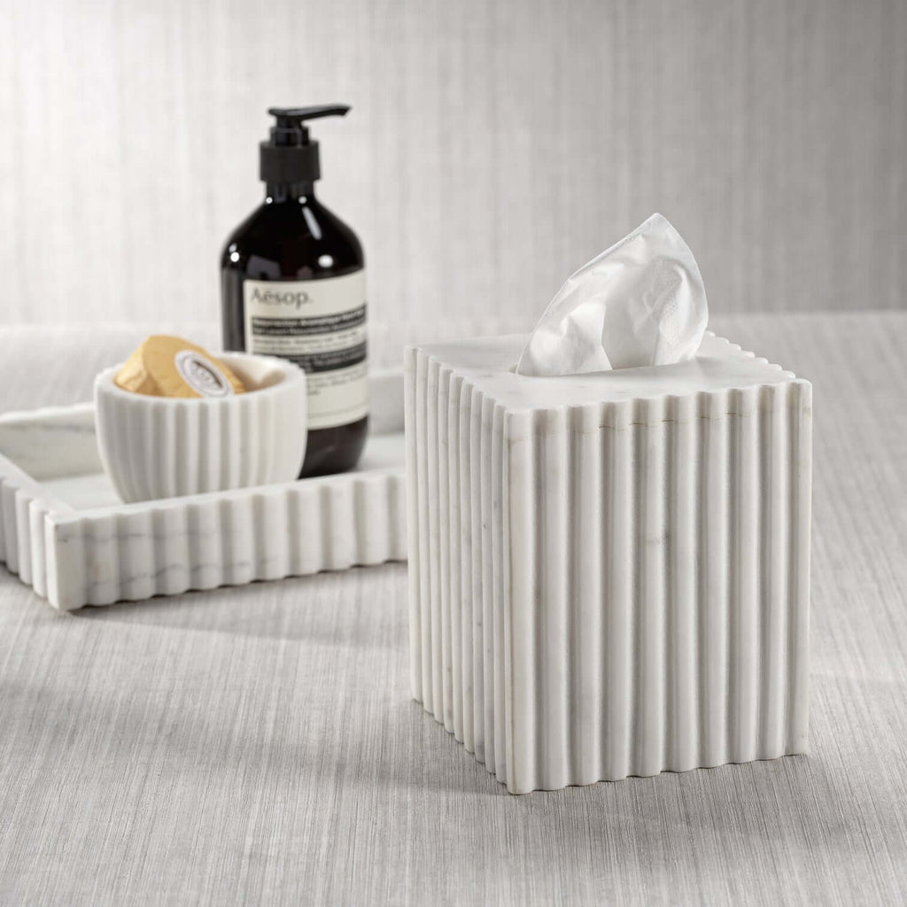 Tissue box from the Camogli Bath Collection, crafted in solid white marble with vertical fluting for a sculptural look.