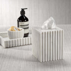 Tissue box from the Camogli Bath Collection, crafted in solid white marble with vertical fluting for a sculptural look.