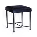 Black stool with a cushioned seat on a white background