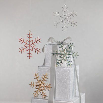 Decorative snowflake ornaments on a gray background