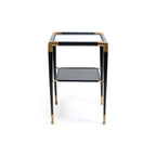 Peninsula Leather Side Table featuring a black leather finish, glass top, and polished brass details.