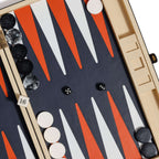 Monaco 19" Backgammon Set featuring a vibrant playing field with burnt orange and white points, black and white checkers.