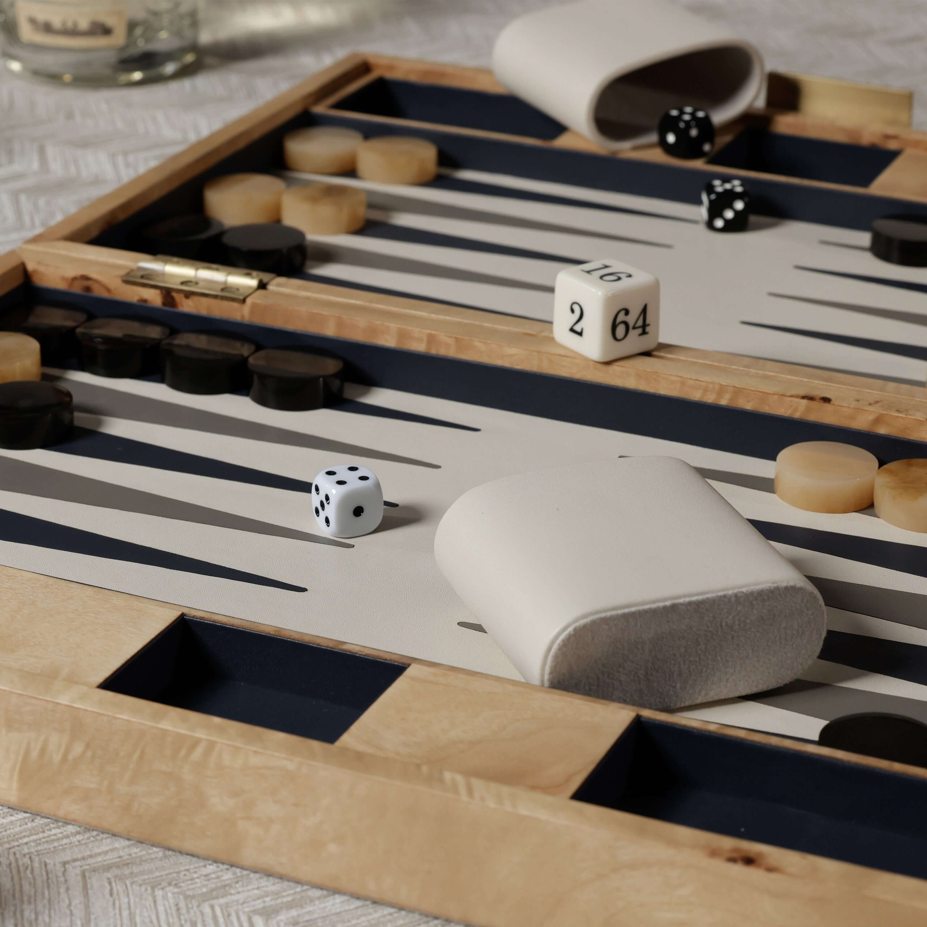 Marbella Backgammon Set displayed with unique burl wood veneer and dice, showcasing its elegant design and craftsmanship.