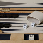Marbella Backgammon Set featuring dice, game pieces, and a burl wood veneer case.