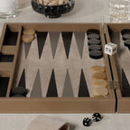 Geneva 19" Backgammon Set - Taupe Leather with game pieces and dice on a stylish table.