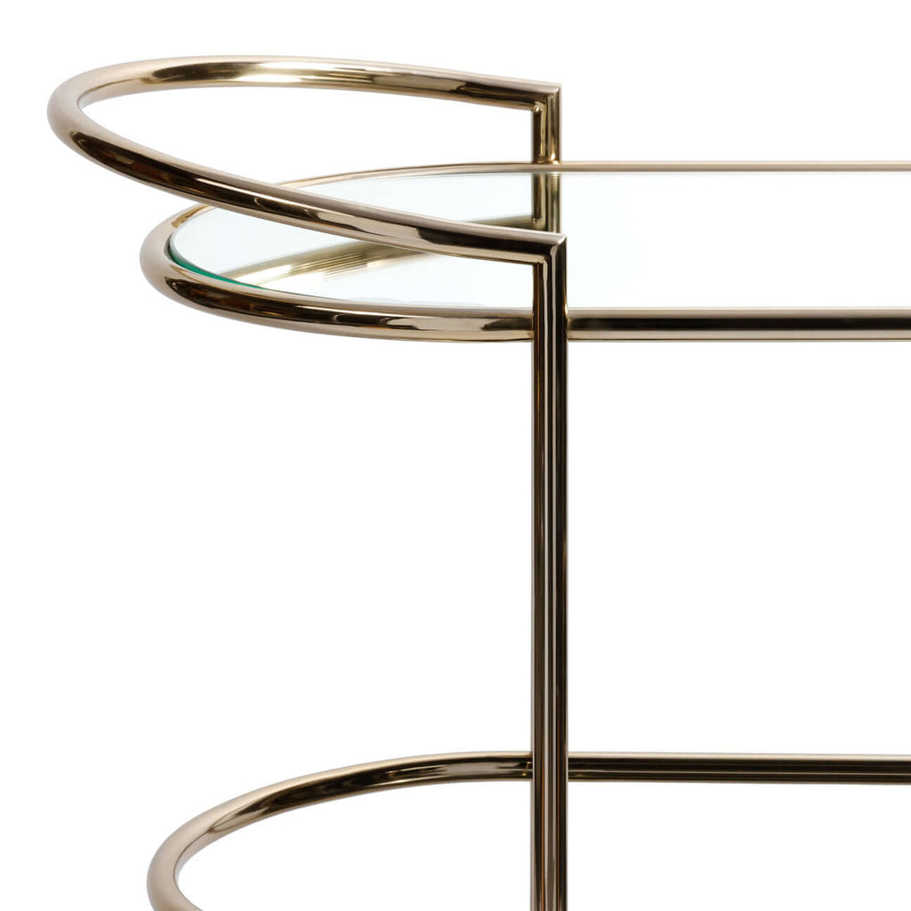 Lido Console Bar Cart with a champagne brass frame and glass top, showcasing elegant design.