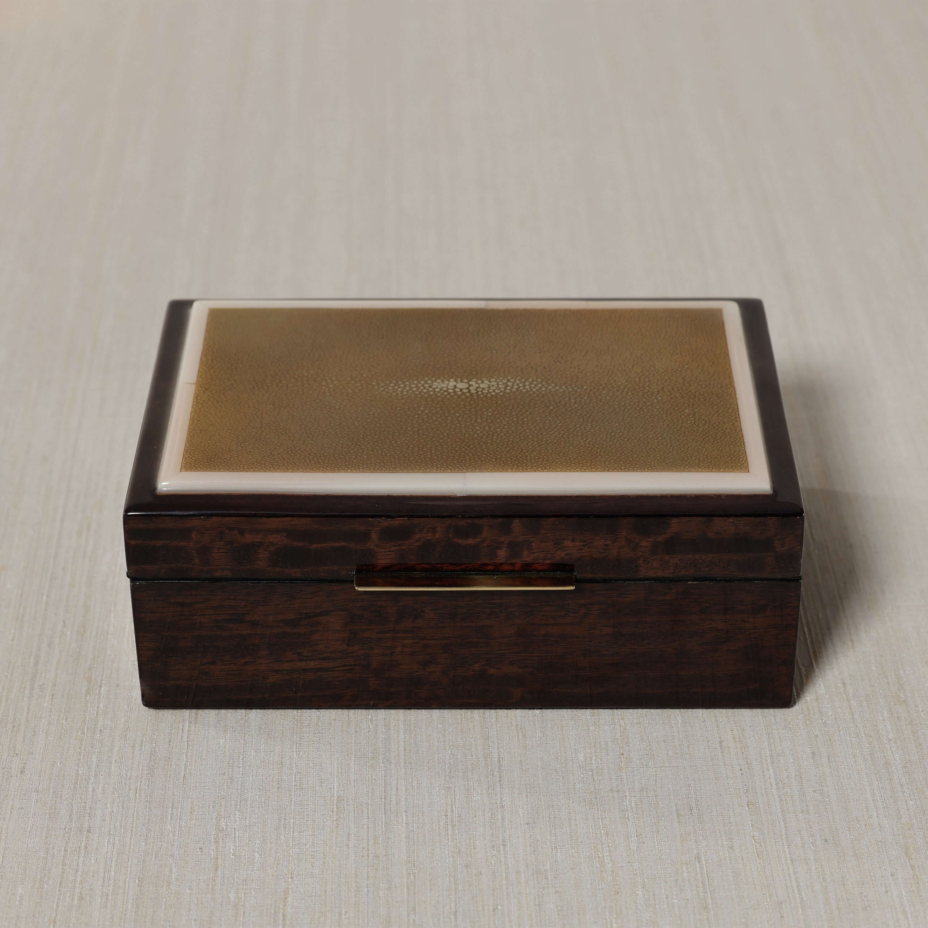 The Langham Box featuring dark espresso wood veneer with smooth lacquer finish.