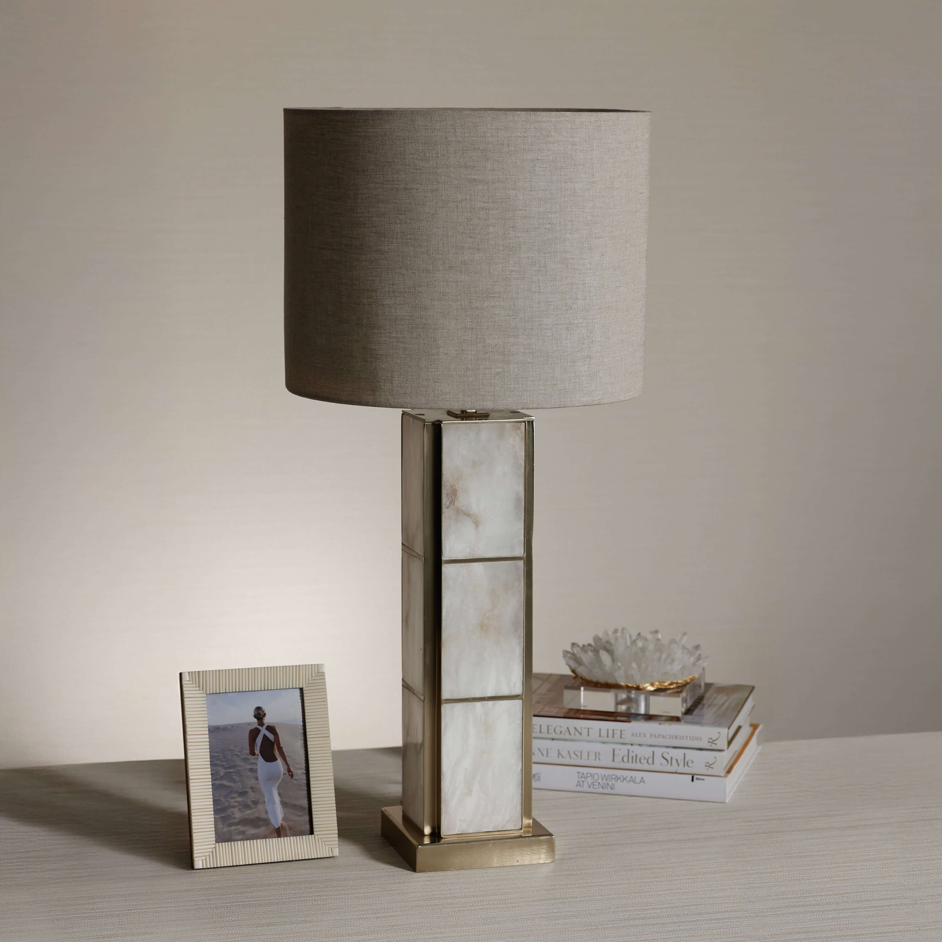 Golden Shore Alabaster Table Lamp with a linen shade, showcasing its unique alabaster base and warm glow.