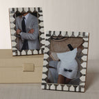 Lagos White Bone & Chiseled Horn Inlaid Photo Frame displaying elegant photos of stylish outfits on a tabletop.