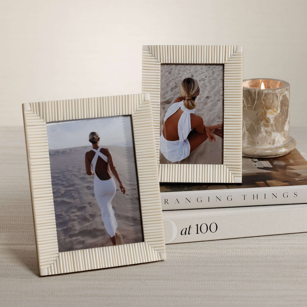 Nubia White Bone Ribbed Photo Frame displaying two elegant images on a styled table with a candle.
