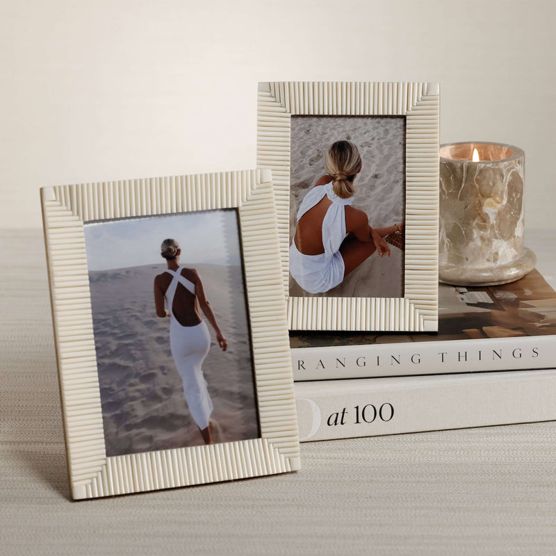 Nubia White Bone Ribbed Photo Frame displaying two elegant images on a styled table with a candle.