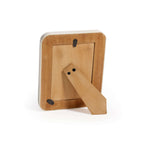 Wooden picture frame with a stand on a white background