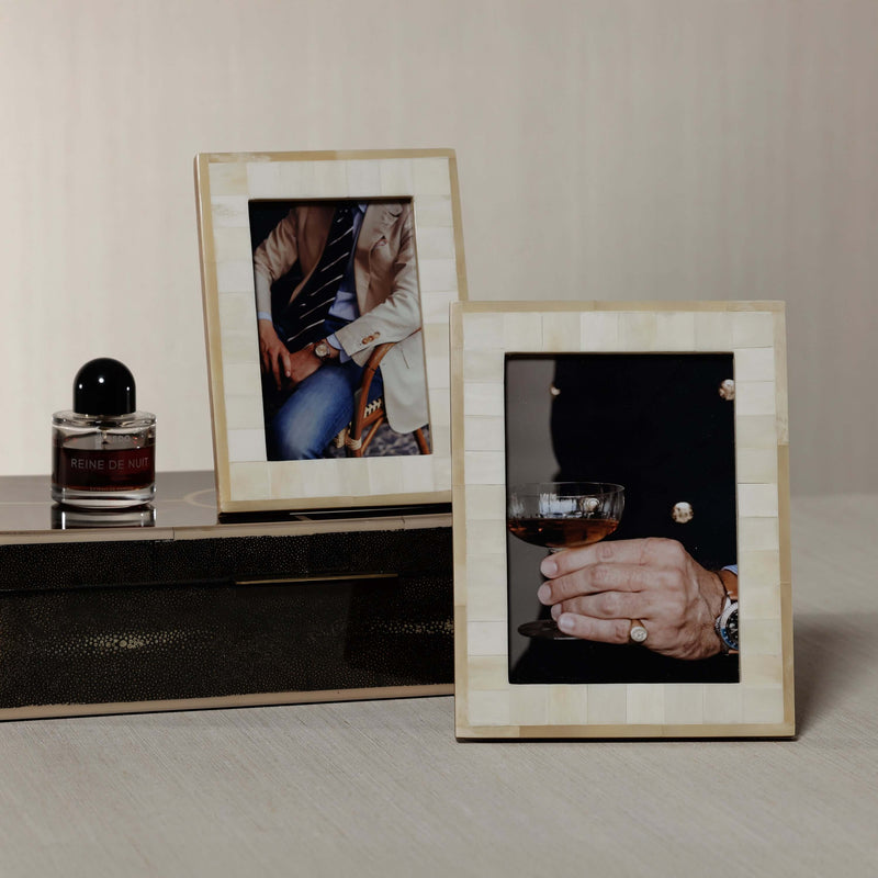 Dune Natural and Bleached White Bone Photo Frame displaying stylish images on a modern table.
