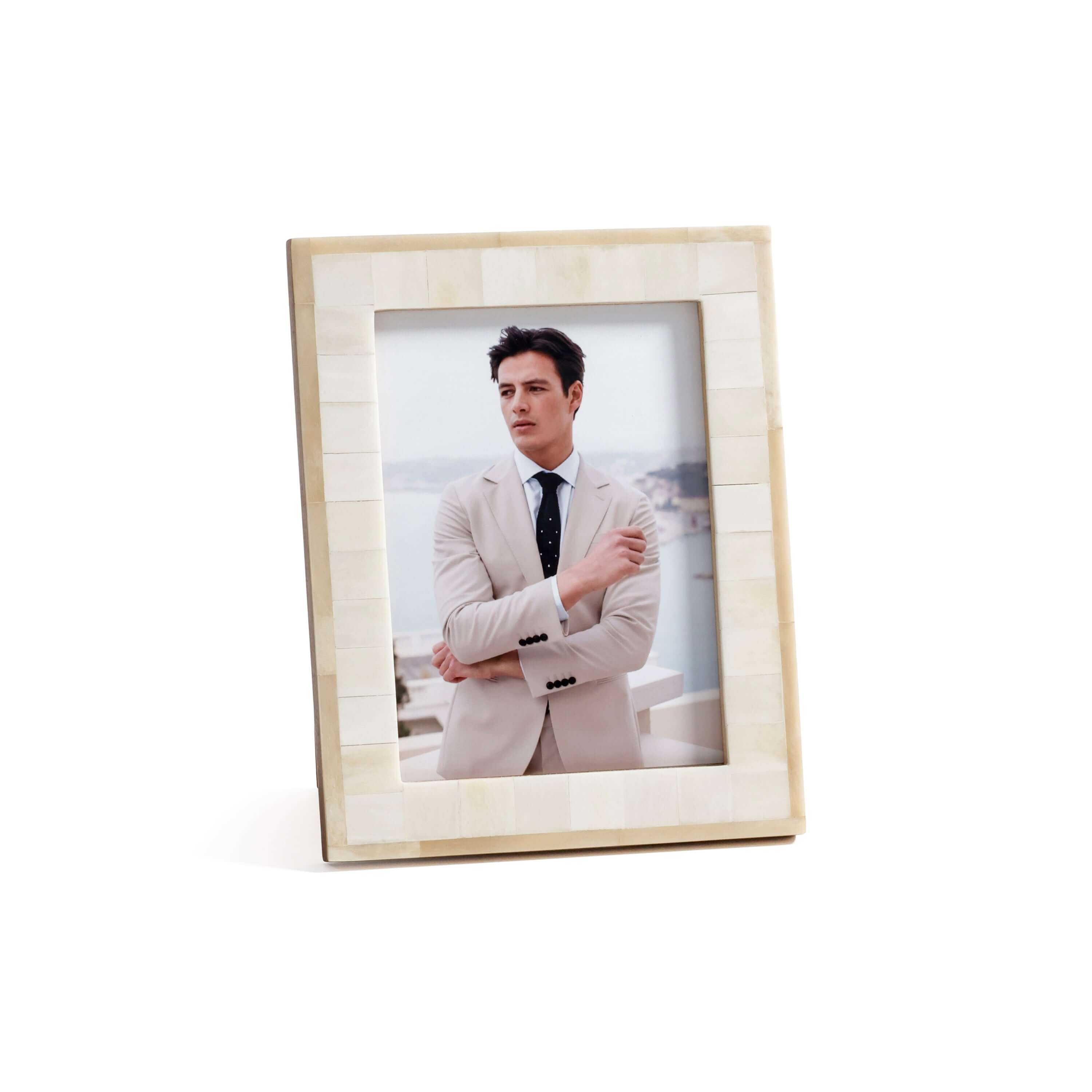 Dune Natural and Bleached White Bone Photo Frame showcasing a man in a suit against a scenic backdrop.