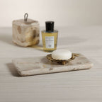 Crema Fossil Marble Bath Collection vanity tray with soap and scented oil, elegant bathroom accessory design.