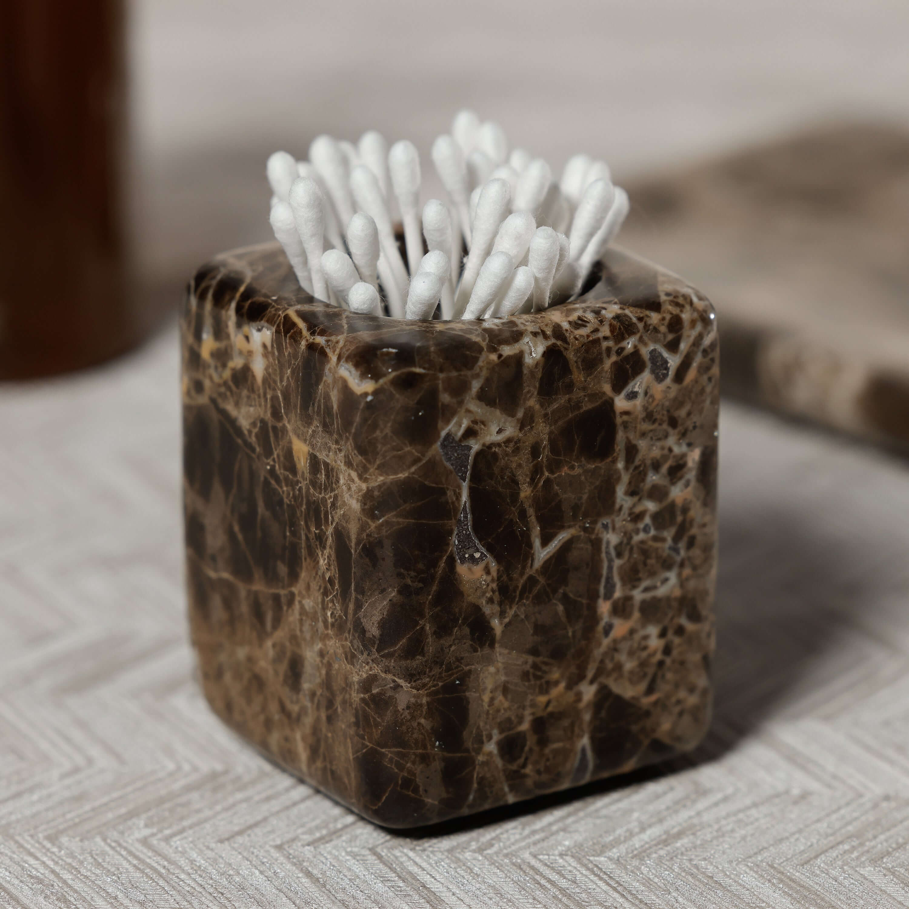 Marrón Emperador Marble Bath Collection square jar with cotton swabs for elegant bathroom decor.