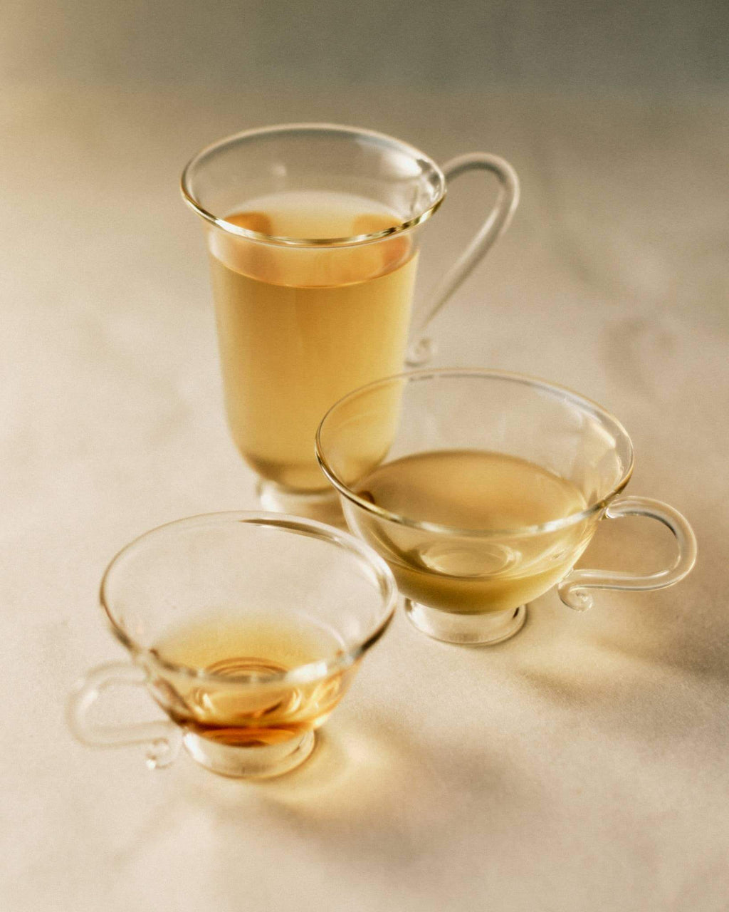 Petite Tasse, Clear (Set of 2) displayed with a curvy silhouette, perfect for tea or coffee.