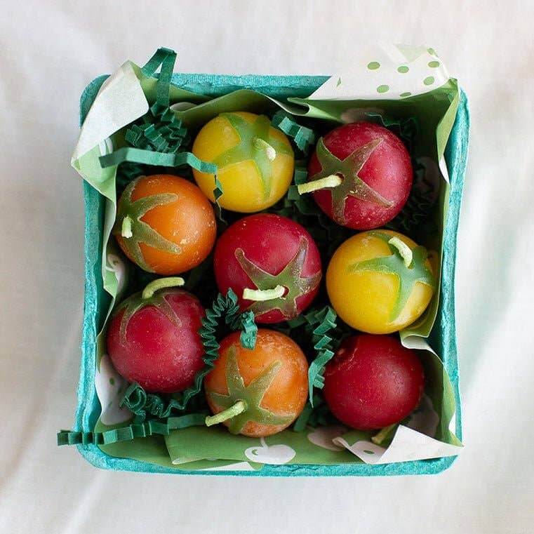 A box of Cherry Tomato Beeswax Birthday Candles 8-count, featuring colorful, handcrafted candles shaped like tomatoes.