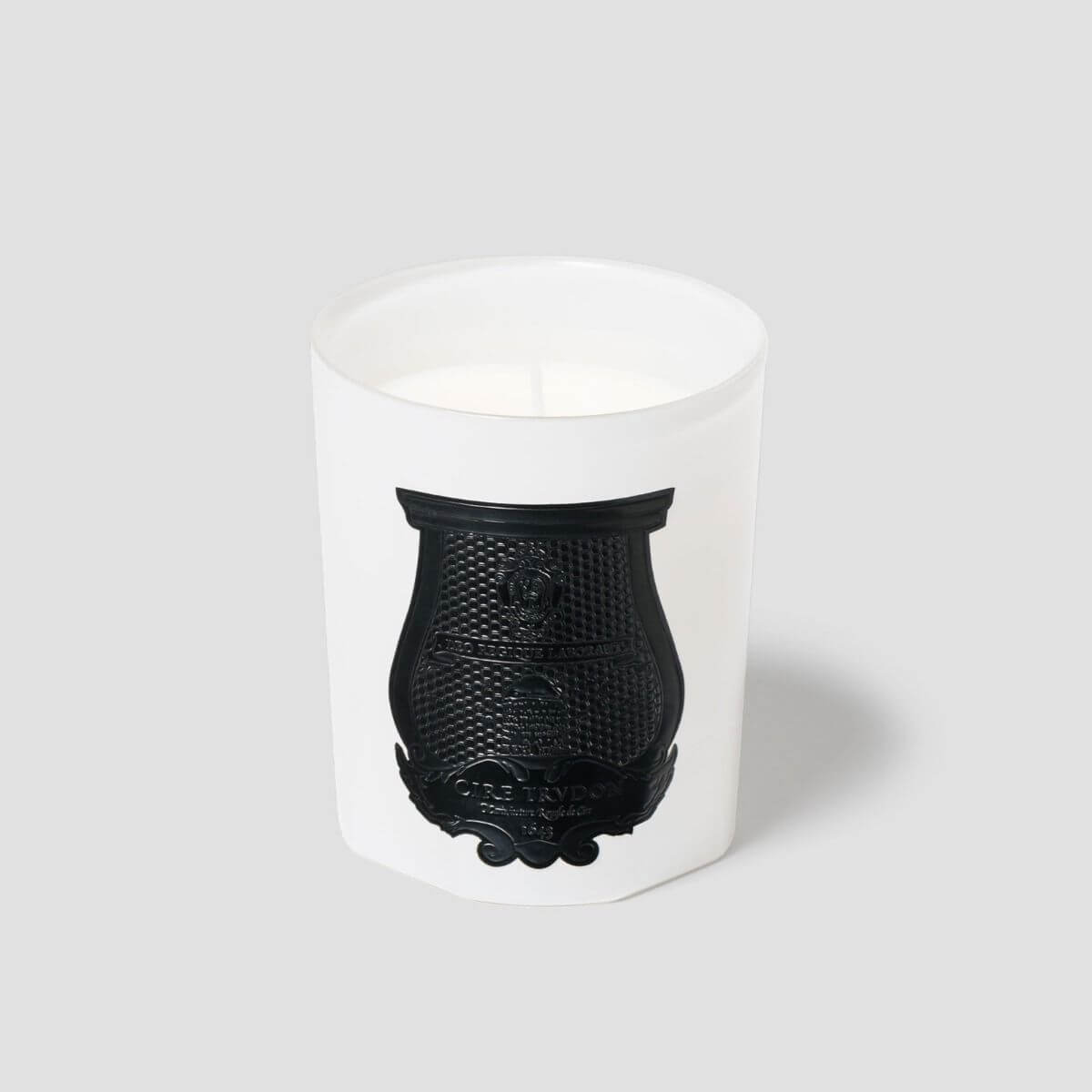 Rose Poivre Classic Candle in elegant white container with black emblem, handcrafted in Normandy, France.
